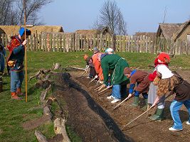 A Viking nobleman inspects the childrens work